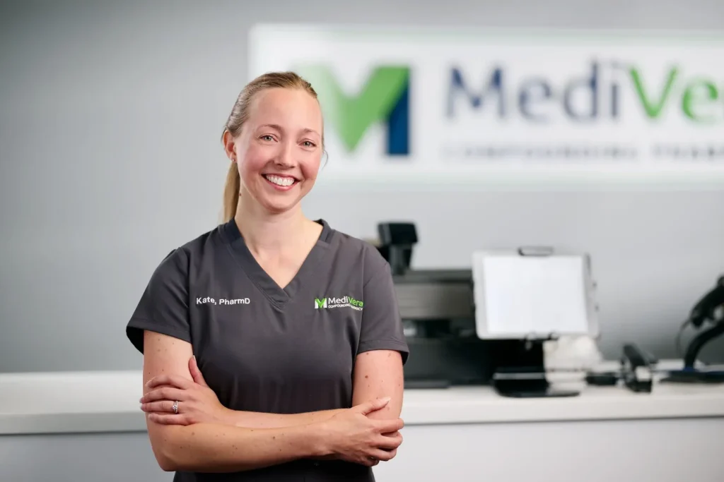 MediVera pharmacist Kate, PharmD, in scrubs at the compounding pharmacy counter