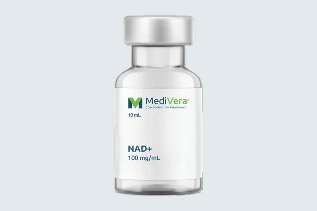 Labeled MediVera NAD+ injection vial on a pale cool-gray studio background
